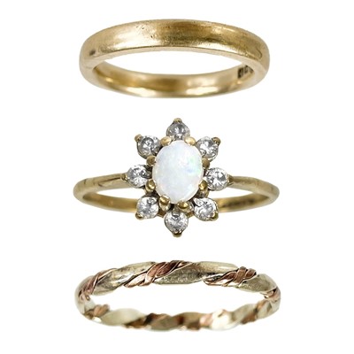 Lot 266 - Two 9ct band rings and an opal white stone set cluster ring.