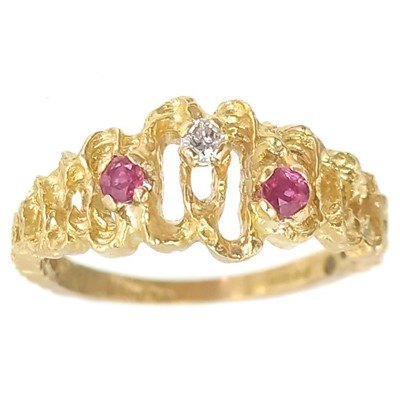 Lot 279 - An 18ct gold diamond and ruby set three stone ring.