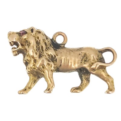 Lot 289 - A high purity gold (tests 18ct) lion charm with ruby eyes.