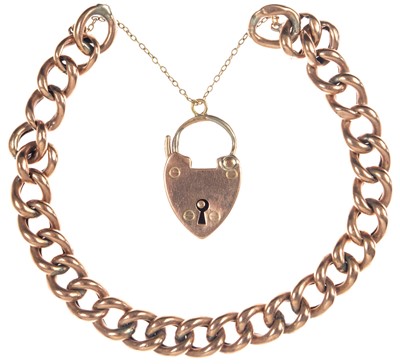 Lot 291 - A 9ct rose gold curb link bracelet with padlock clasp.