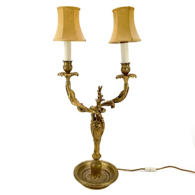 Lot 166 - A French ormolu twin branch candelabrum.