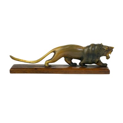 Lot 414 - A Chinese carved horn model of a lion, early 20th century.