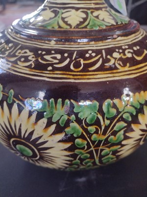Lot 184 - An Islamic pottery vase, probably Bombay School of Arts, late 19th century.