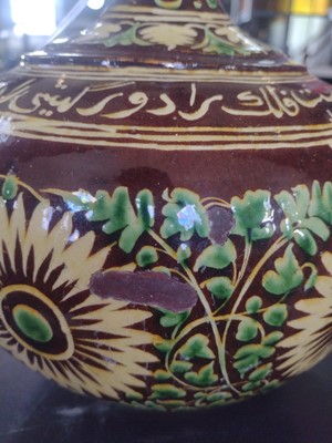Lot 184 - An Islamic pottery vase, probably Bombay School of Arts, late 19th century.