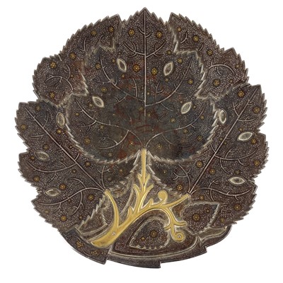 Lot 189 - An Indo-Persian gold and silver koftgari steel plate, 19th century.