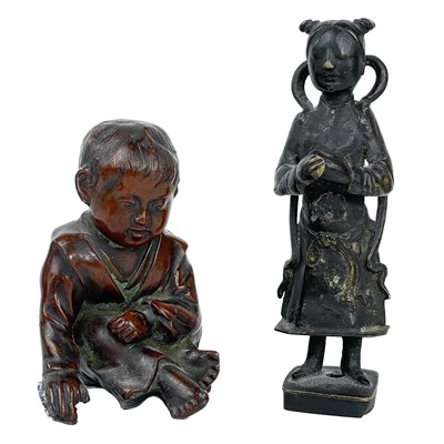 Lot 428 - A Chinese bronze figure of a lady in traditional dress, 18th century.