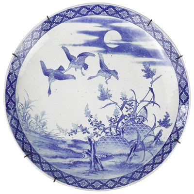 Lot 190 - A Japanese blue and white porcelain charger, Meiji period.