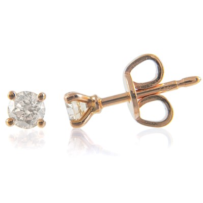 Lot 241 - A pair of contemporary 18ct rose gold champagne diamond stud earrings.