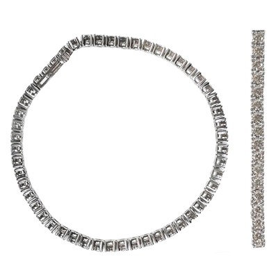 Lot 24 - A dazzling 9ct white gold diamond set 3.77ct line bracelet.