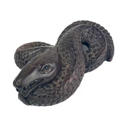 Lot 1180 - A Japanese netsuke in the form of a cobra, Meiji period.