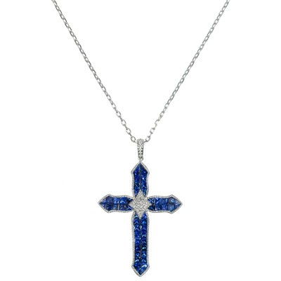 Lot 253 - A stylish contemporary 18ct white gold sapphire and diamond set cross pendant.