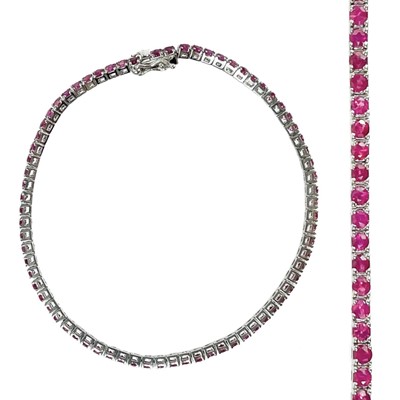 Lot 267 - A contemporary 18ct white gold ruby set line bracelet.