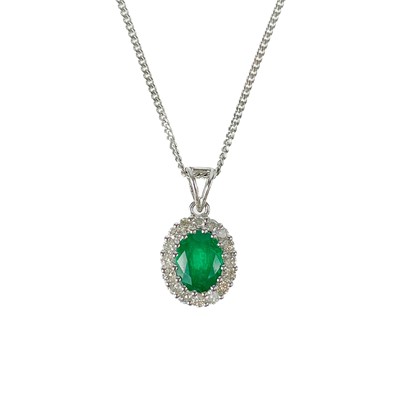 Lot 190 - An 18ct white gold emerald and diamond cluster pendant on a silver chain.