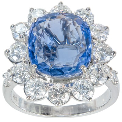 Lot 196 - An impressive 18ct white gold 4.97ct cushion sapphire and diamond cluster ring.