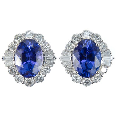 Lot 334 - An astonishing pair of 18ct certified oval tanzanite and diamond cluster earrings.