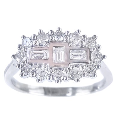 Lot 335 - An 18ct white gold diamond set dress ring.