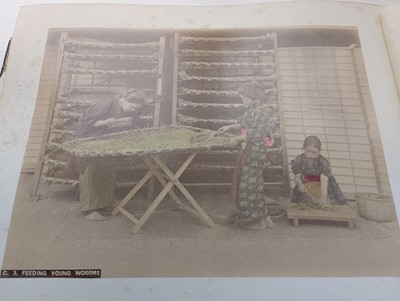 Lot 260 - A Japanese photo album containing 50 hand coloured images, circa 1900.