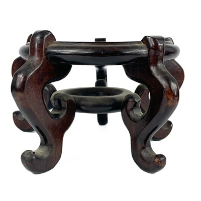 Lot 445 - A Chinese carved hardwood plate display stand, 19th century