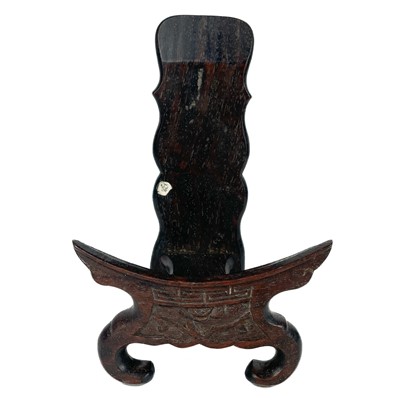 Lot 445 - A Chinese carved hardwood plate display stand, 19th century