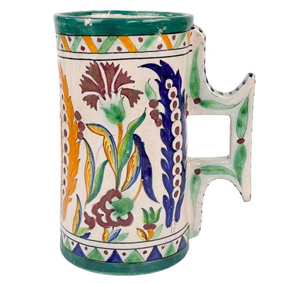 Lot 226 - An Iznik style tin glazed pottery tankard, early 20th century.