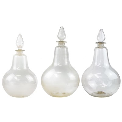 Lot 125 - Three large late Victorian glass carbouys and stoppers.