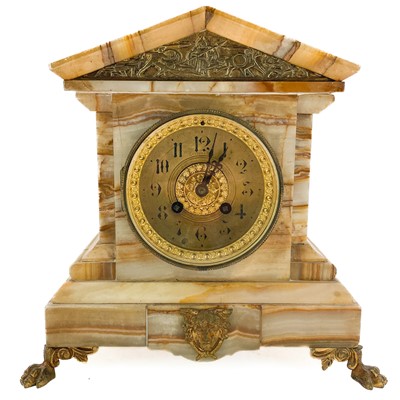 Lot 323 - A French onyx cased mantel clock.