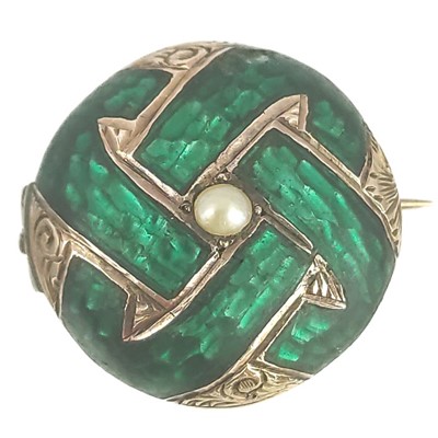 Lot 339 - A Victorian green enamel seed pearl set locket bombe brooch.