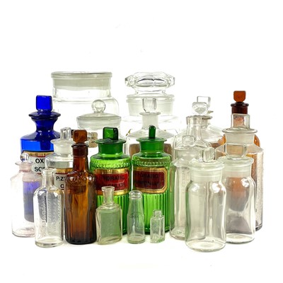 Lot 221 - A collection of glass apothecary bottles.