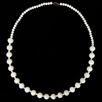 Lot 456 - A Chinese white jade bead necklace with 9ct gold clasp.