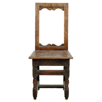 Lot 127 - A 17th century oak back stool.