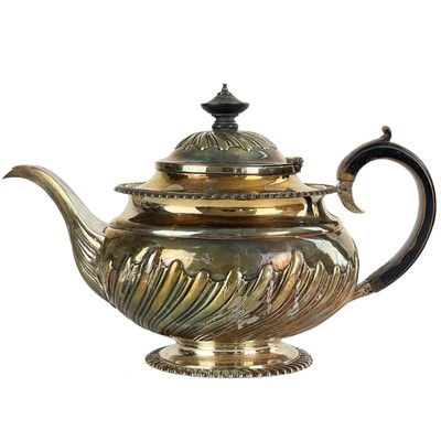 Lot 14 - A George IV silver half wrythen fluted teapot by Jonathan Hayne.