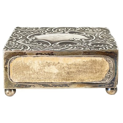 Lot 75 - A Victorian silver foliate scroll embossed matchbox holder by Crisford & Norris.