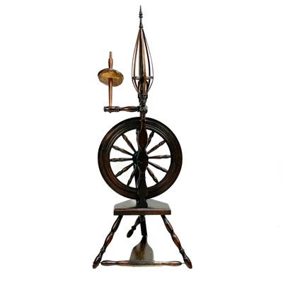 Lot 96 - An oak and ash spinning wheel.