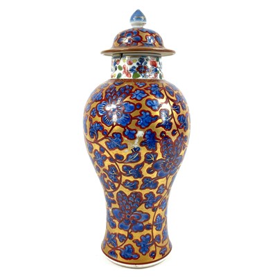 Lot 58 - A Chinese 'clobbered' porcelain vase and cover, 19th century.