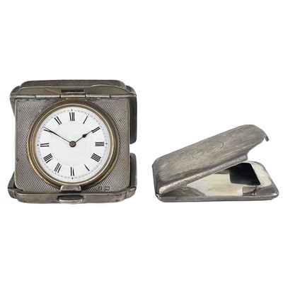 Lot 80 - A George V silver engine turned travel timepiece by Mappin & Webb.