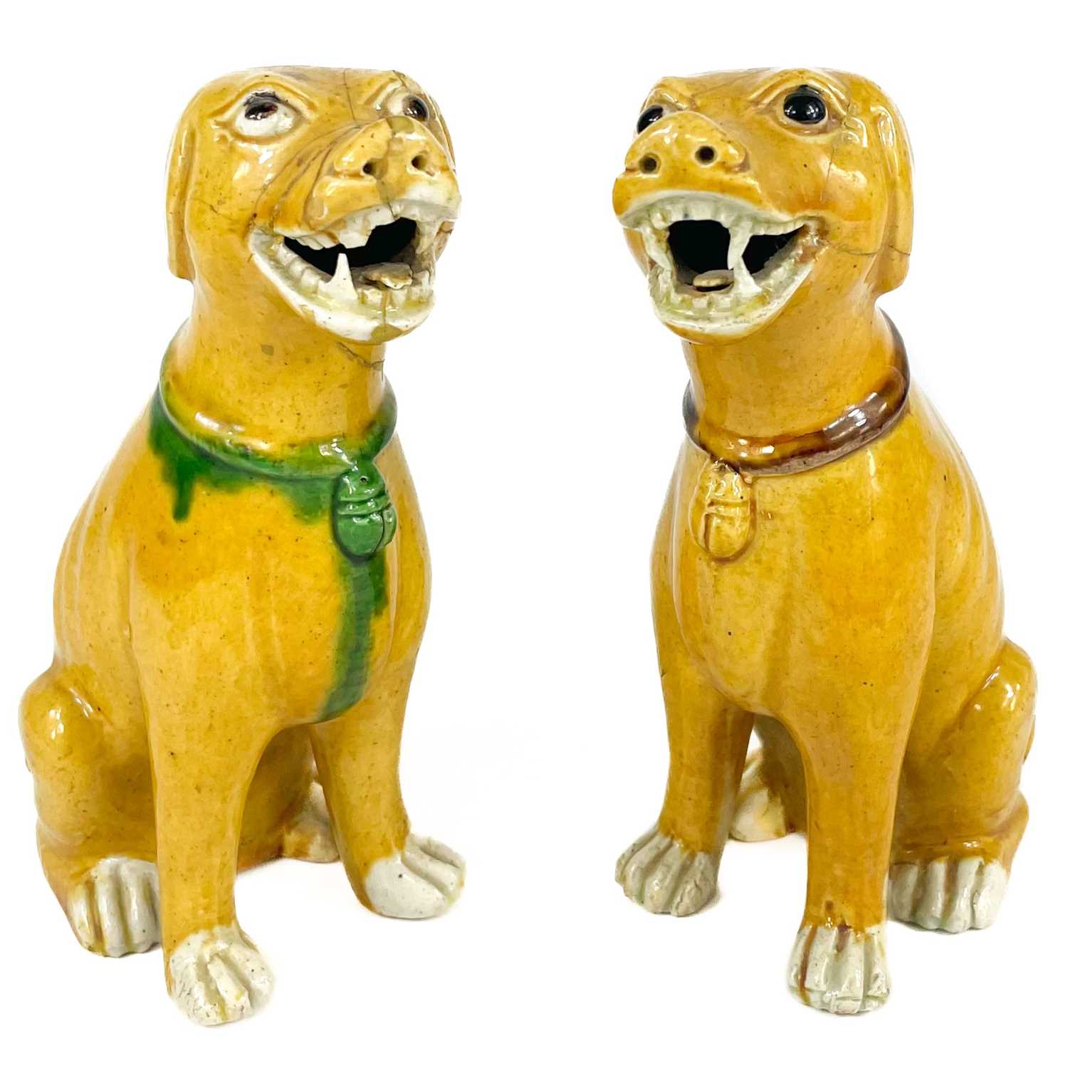 Lot 67 - A pair of Chinese export famille verte sancai-glazed dogs, 18th/19th century.