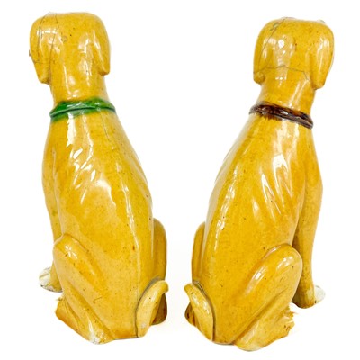 Lot 67 - A pair of Chinese export famille verte sancai-glazed dogs, 18th/19th century.