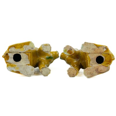 Lot 67 - A pair of Chinese export famille verte sancai-glazed dogs, 18th/19th century.