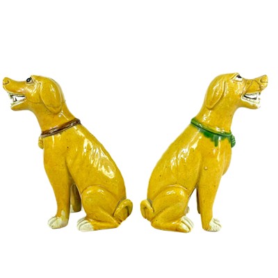 Lot 67 - A pair of Chinese export famille verte sancai-glazed dogs, 18th/19th century.