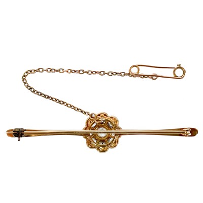 Lot 22 - An early 20th century gold and platinum diamond cluster bar brooch.