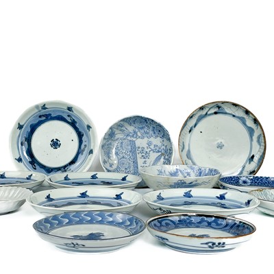 Lot 483 - Thirteen Japanese blue and white porcelain plates, 19th century.