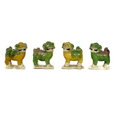 Lot 62 - Four Chinese biscuit water-dropper models of Bhuddist lions, Yongzheng Period.