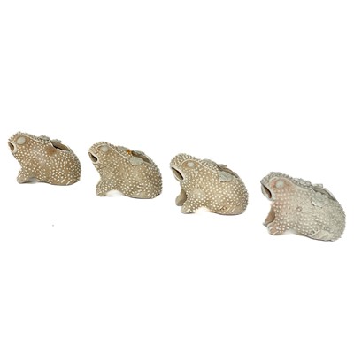 Lot 63 - Four rare biscuit water droppers modelled as toads, Yongzheng period.