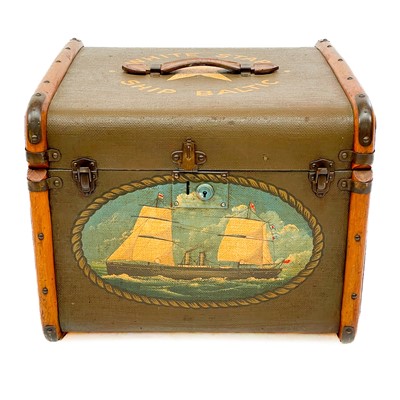 Lot 672 - A wood and leather mounted cabin trunk.