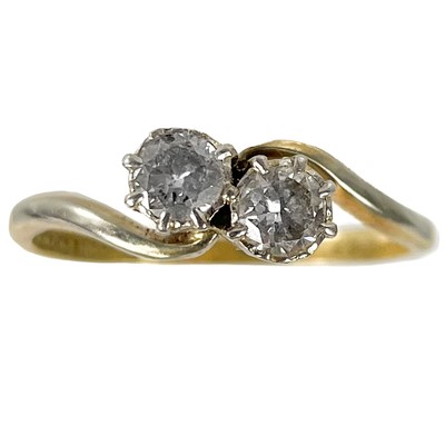 Lot 380 - An 18ct and platinum diamond crossover ring.