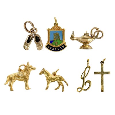 Lot 383 - A collection of seven 9ct charms.