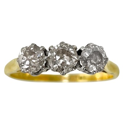 Lot 391 - An 18ct diamond set three stone ring.