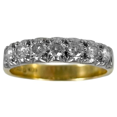 Lot 400 - An 18ct diamond set seven stone half hoop ring.