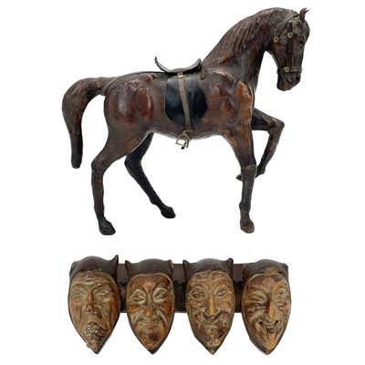 Lot 18 - A leather model of a harnessed horse.