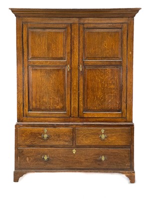 Lot 48 - A George III oak livery cupboard or wardrobe.